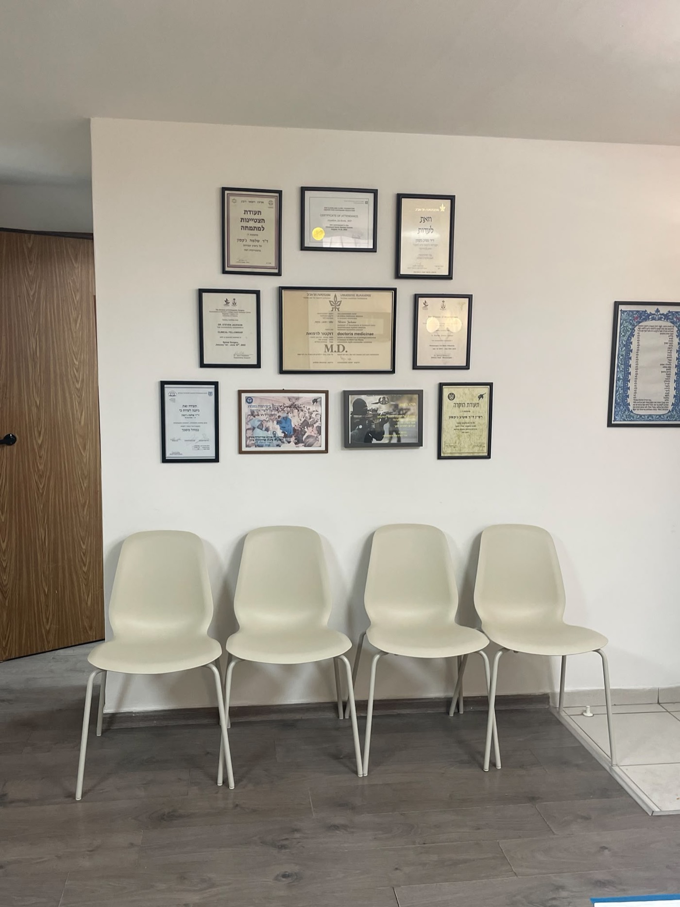 The waiting room and wall of certifications