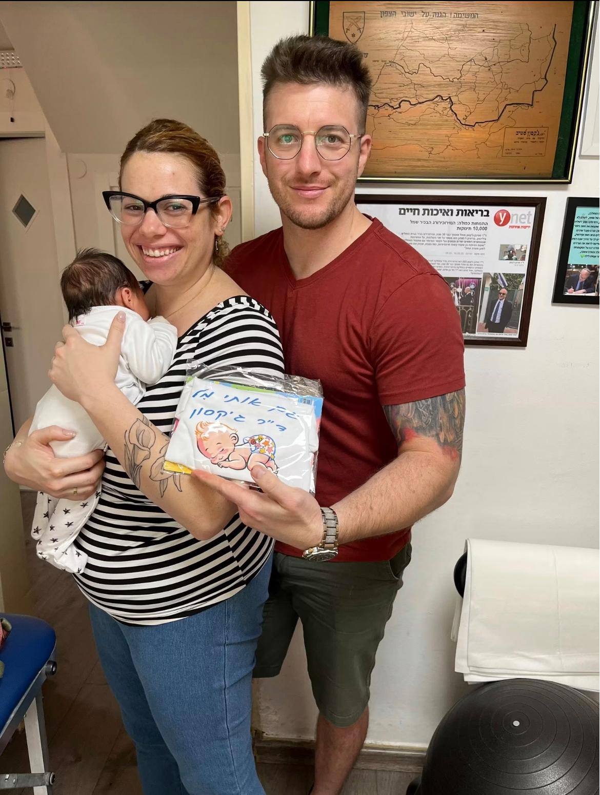 A family with their baby at the clinic